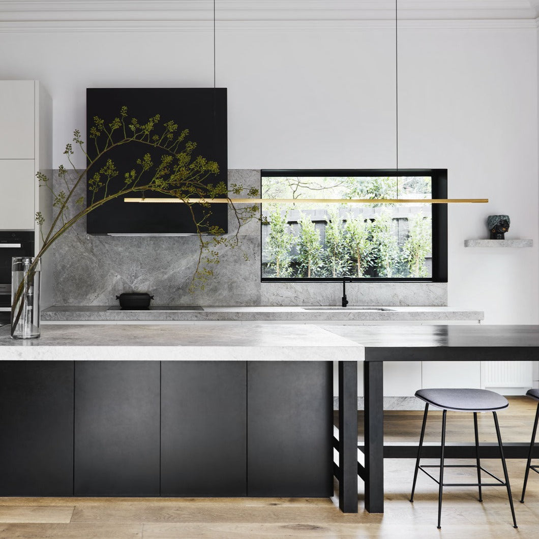 Highline Linear Pendant in Satin Brass with Walnut over Kitchen Island and Breakfast Table Squared