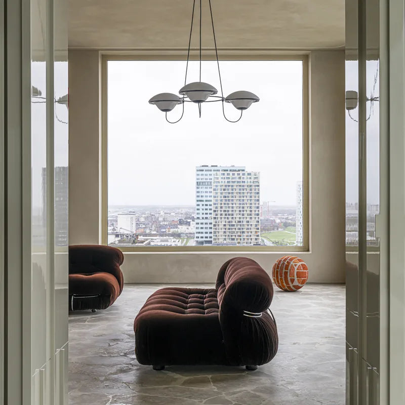 DCW Editions In The Air pendant with 3 shades in modern lounge, unlit, in front of window