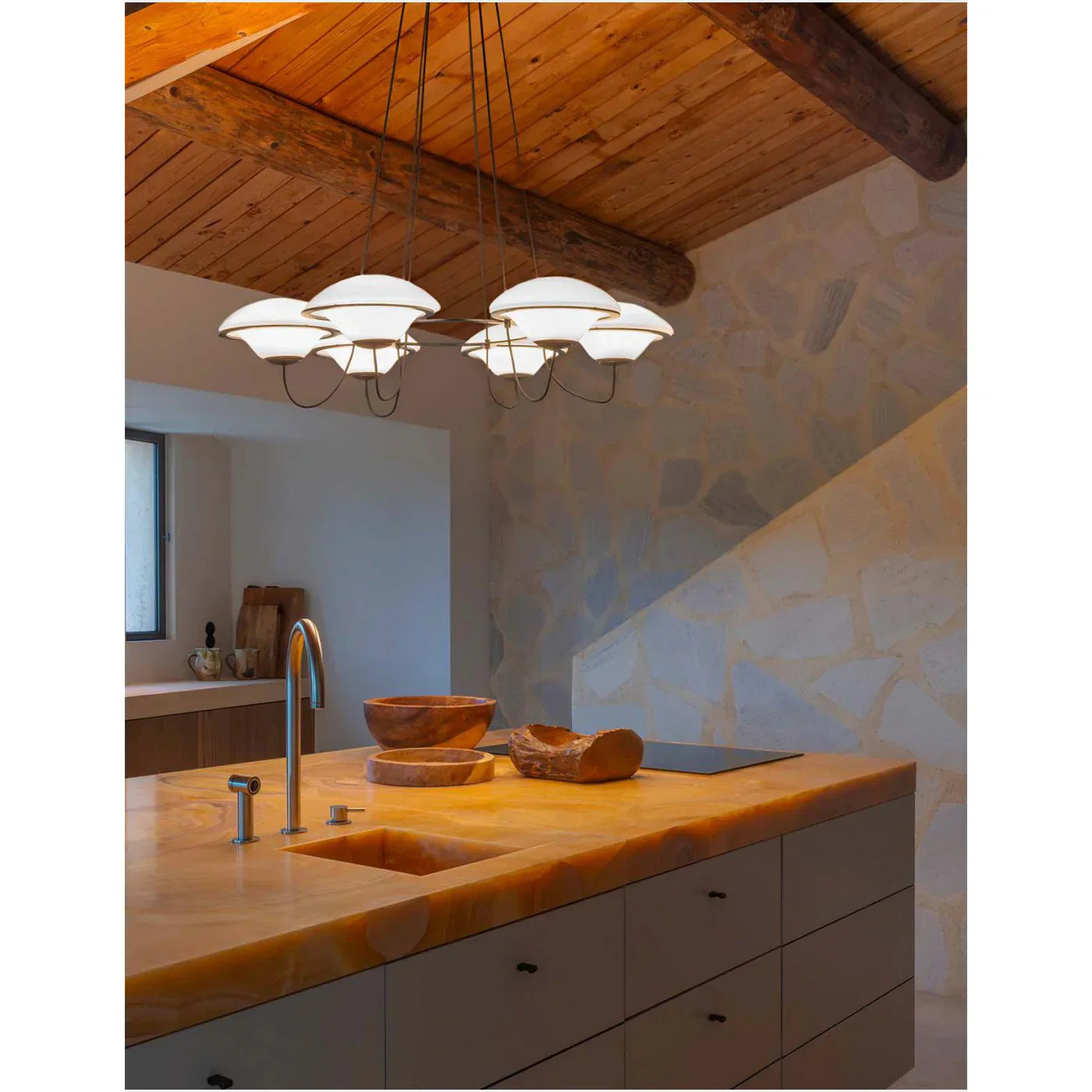 DCW Editions In The Air pendant with 5 shades over large stone kitchen island