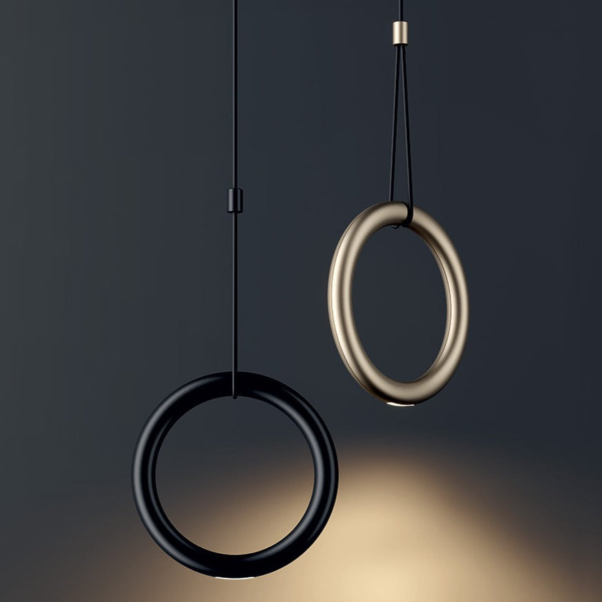 Lodes Ivy Pendants in black and gold with dark background