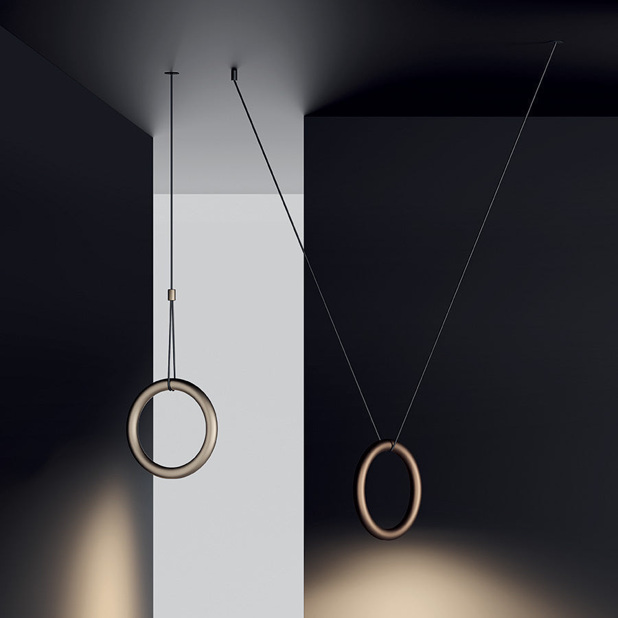 Lodes Ivy pendants shining light downwards with a dark background