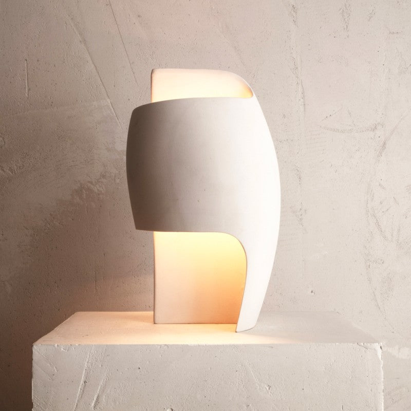 DCW Editions Lamp B table lamp on pedestal, softly lit