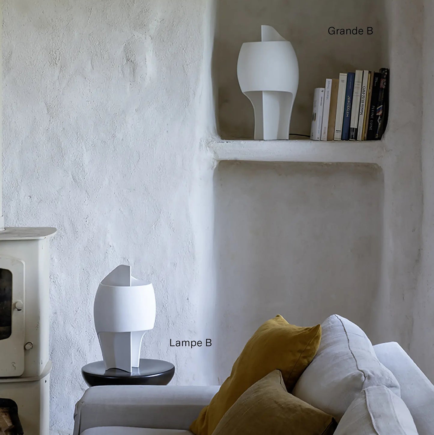 DCW Editions LampeB Grande table lamp in lounge with white plaster walls and white sofa