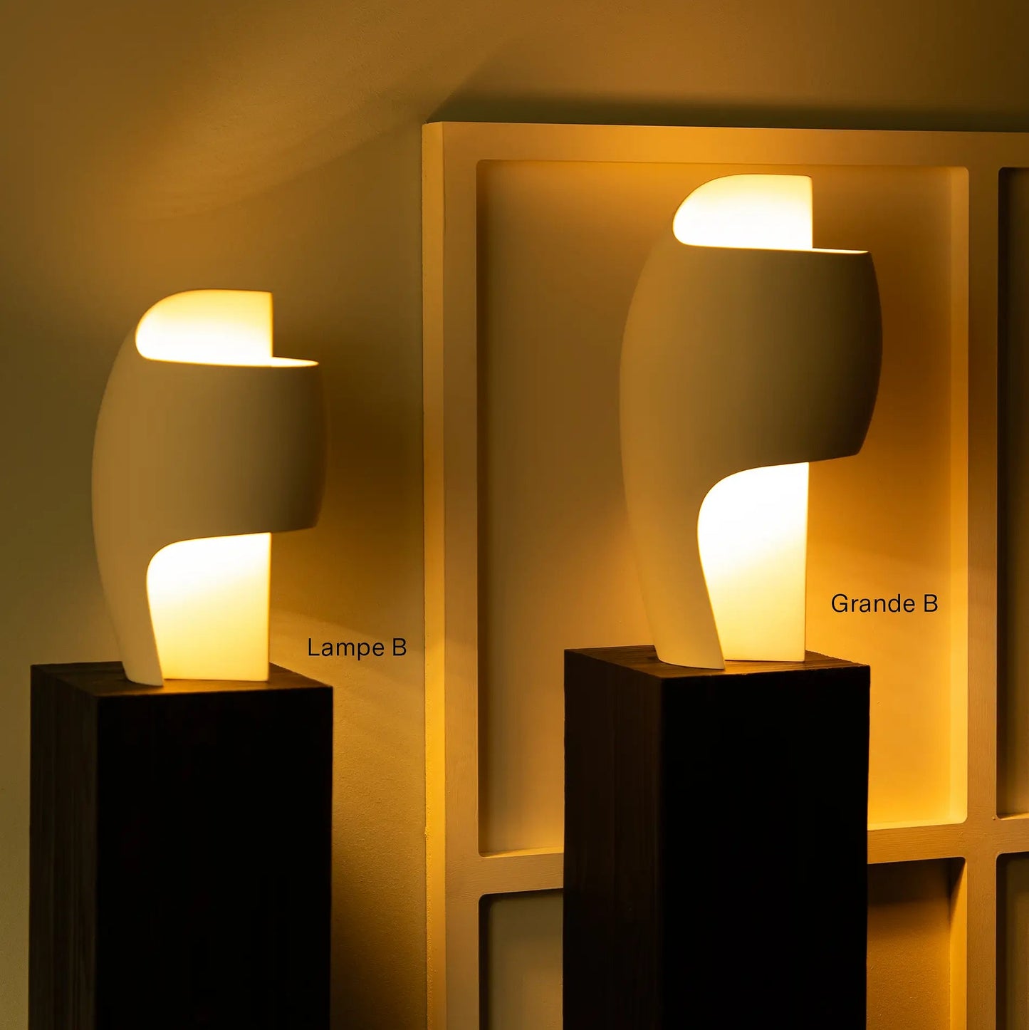 DCW Editions LampeB Grande table lamp and regular LampeB side by side on black pillars