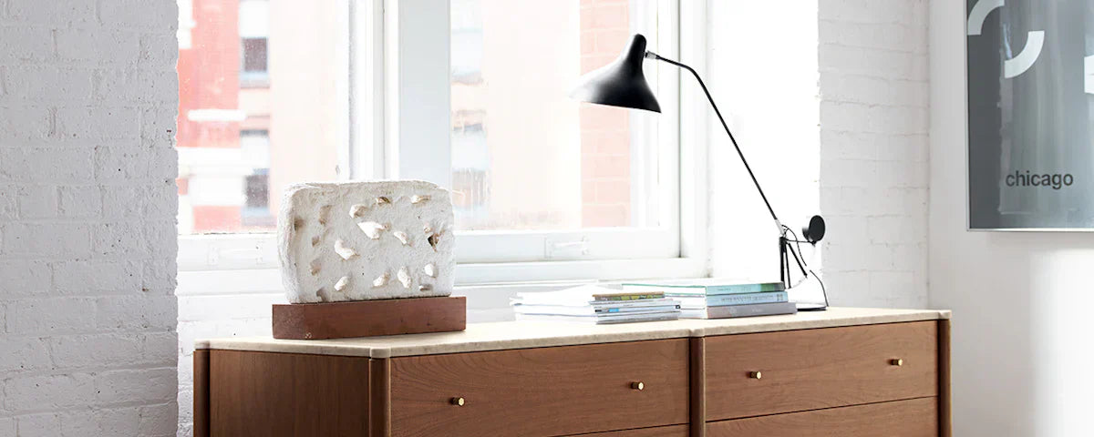 DCW Editions Mantis table lamp on mid-century modern console table