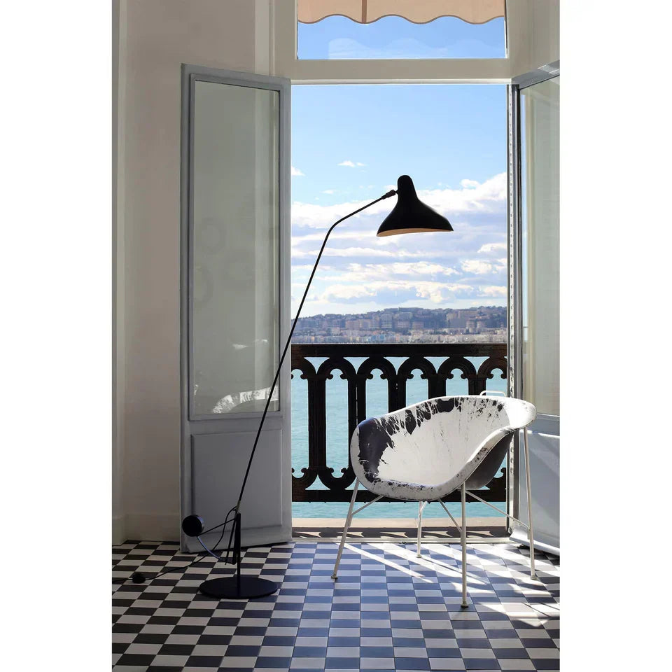 DCW Editions Mantis floor lamp BS1 in room with views of the mountains and sea
