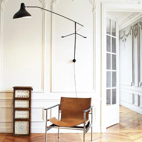 DCW Editions Mantis plug-in wall light BS2 in neo-classical interior with brown leather chair