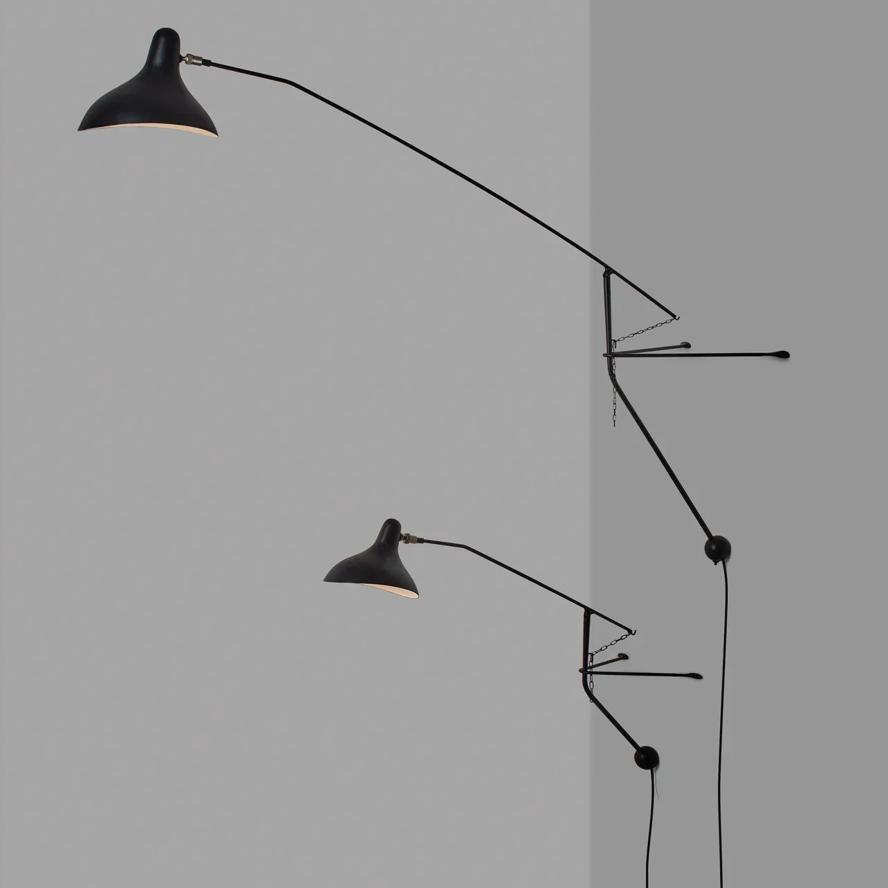 DCW Editions Mantis plug-in wall light BS2 in two sizes on grey wall