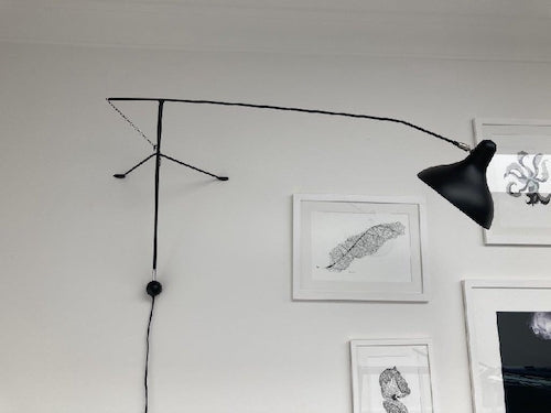 DCW Editions Mantis plug-in wall light BS2 on wall with art work