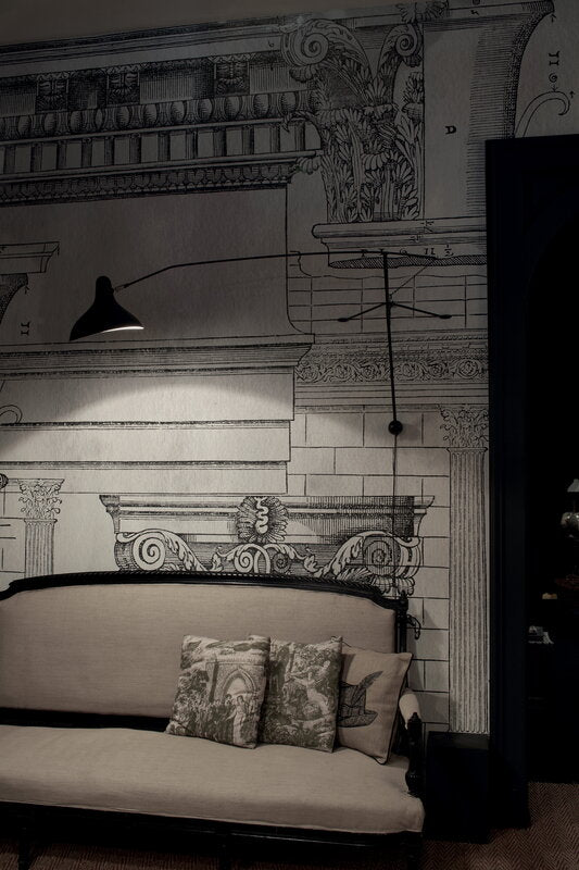 DCW Editions Mantis plug-in wall light BS2 above sofa in with cushions