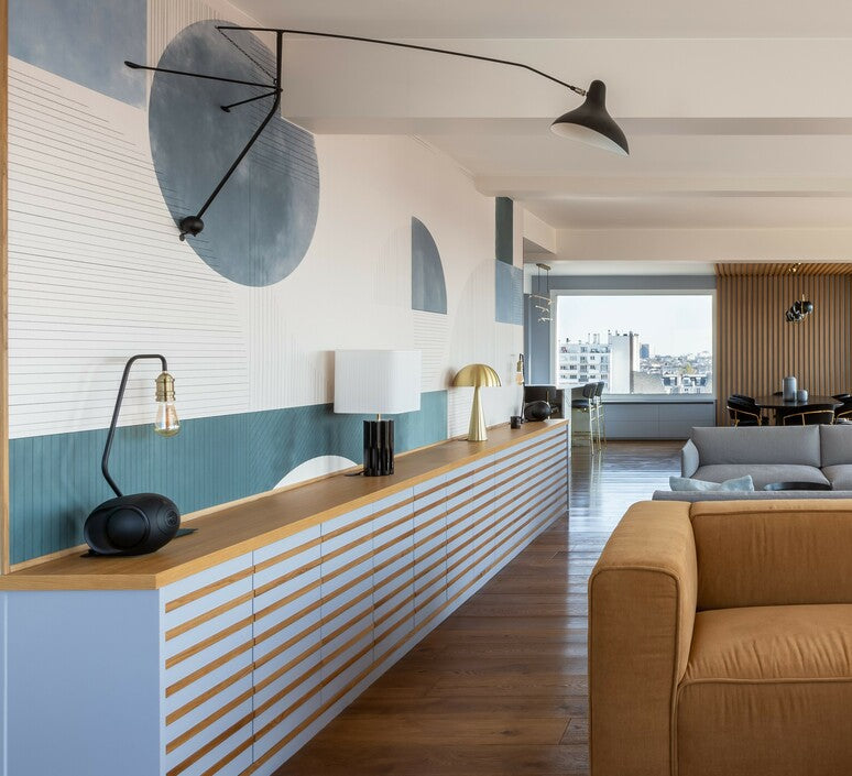 DCW Editions Mantis plug-in wall light BS2 above long, modern blue and wooden console table