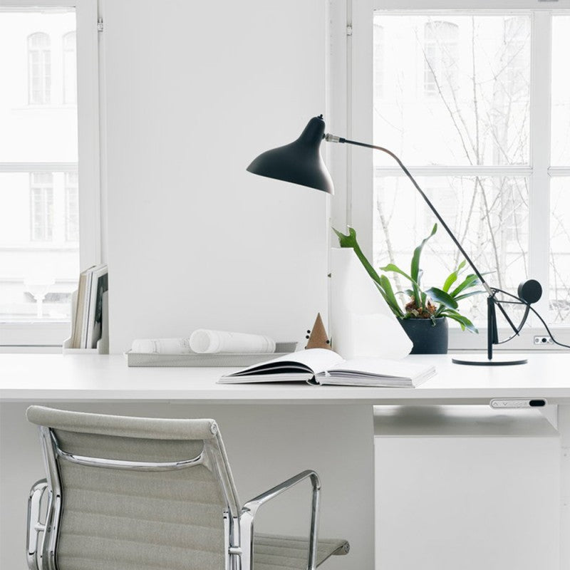 DCW Editions Mantis table lamp on modern, white desk with white office chair