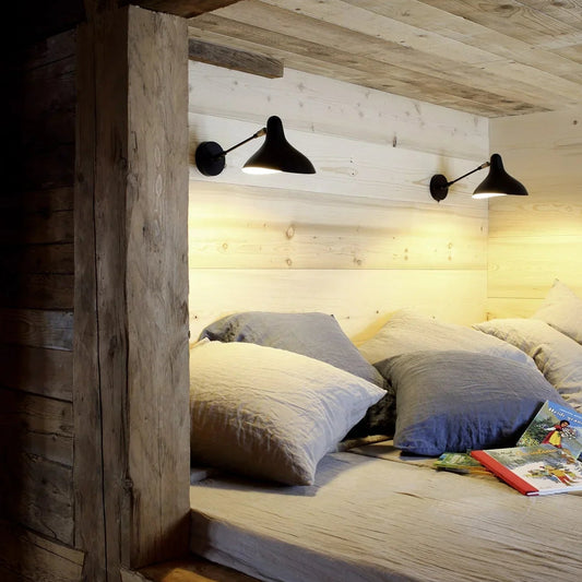 DCW Editions Mantis wall light standard BS5 with thumbswitch on wooden wall above reading nook with cushions and children's books