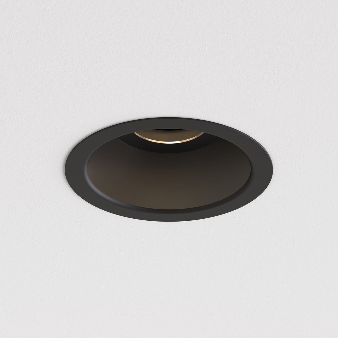Black recessed ceiling light on a white background