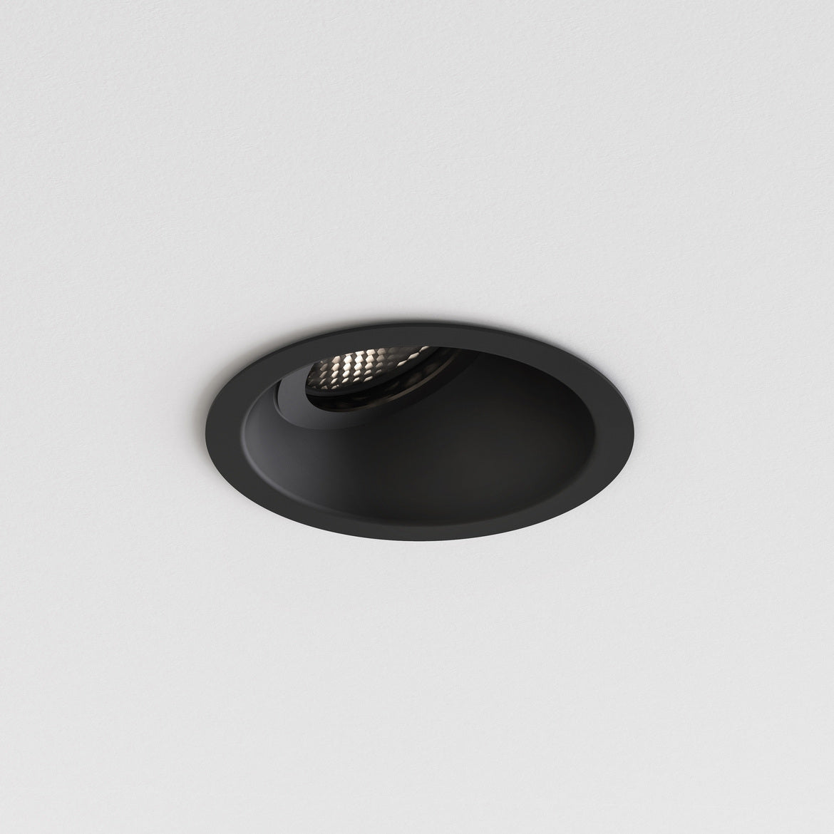 Black recessed ceiling light on a white background