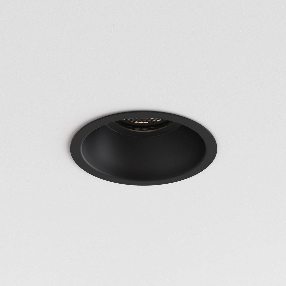 Black recessed ceiling light on a white background