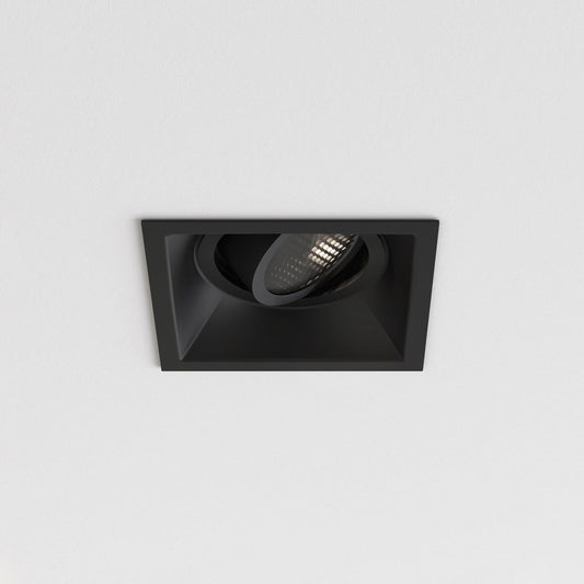 Black square recessed ceiling light on a gray background