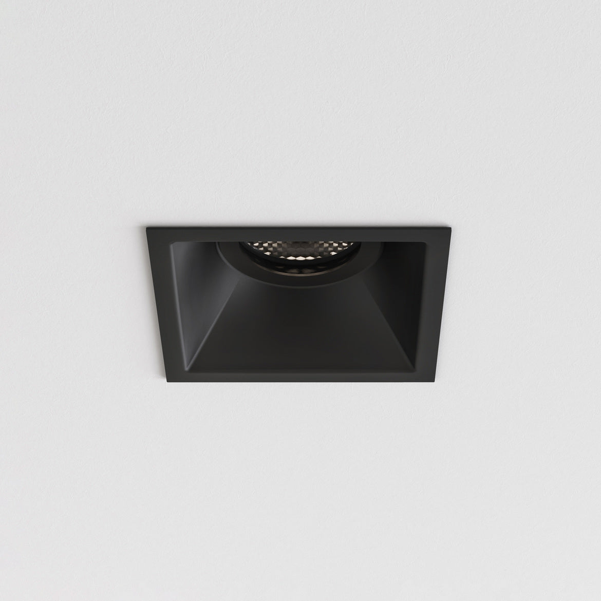Black square recessed ceiling light on a gray background