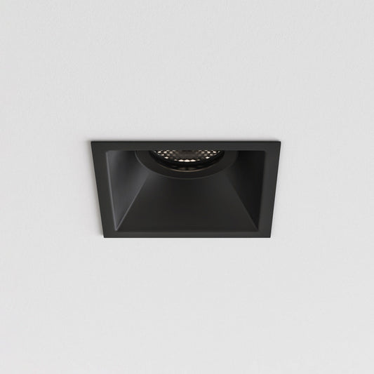 Black square recessed ceiling light on a gray background