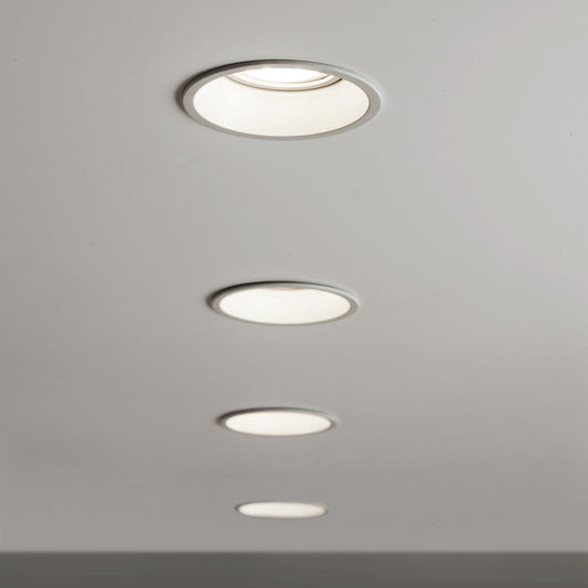 Set of four recessed ceiling lights on a gray ceiling
