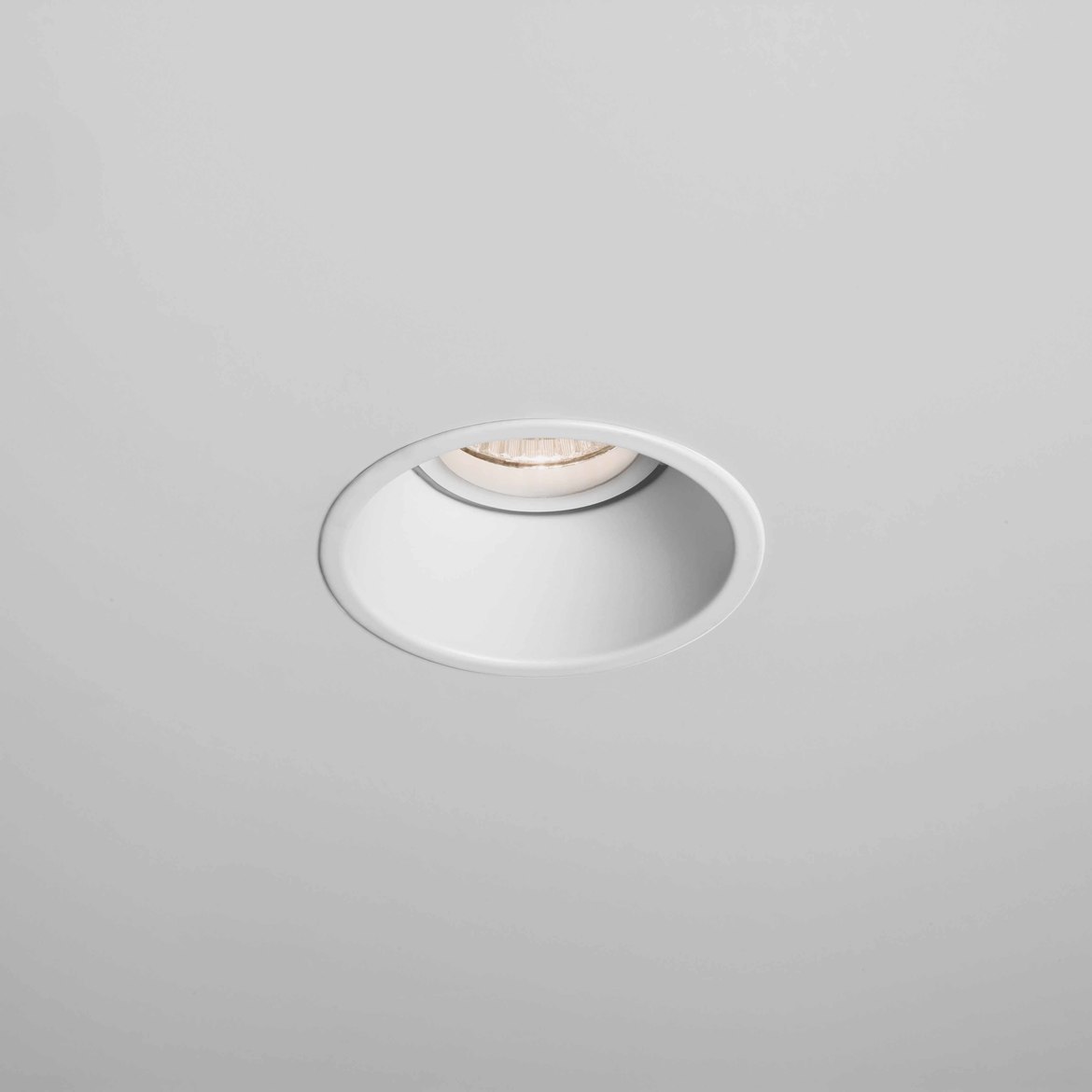 Round recessed ceiling light on a gray background