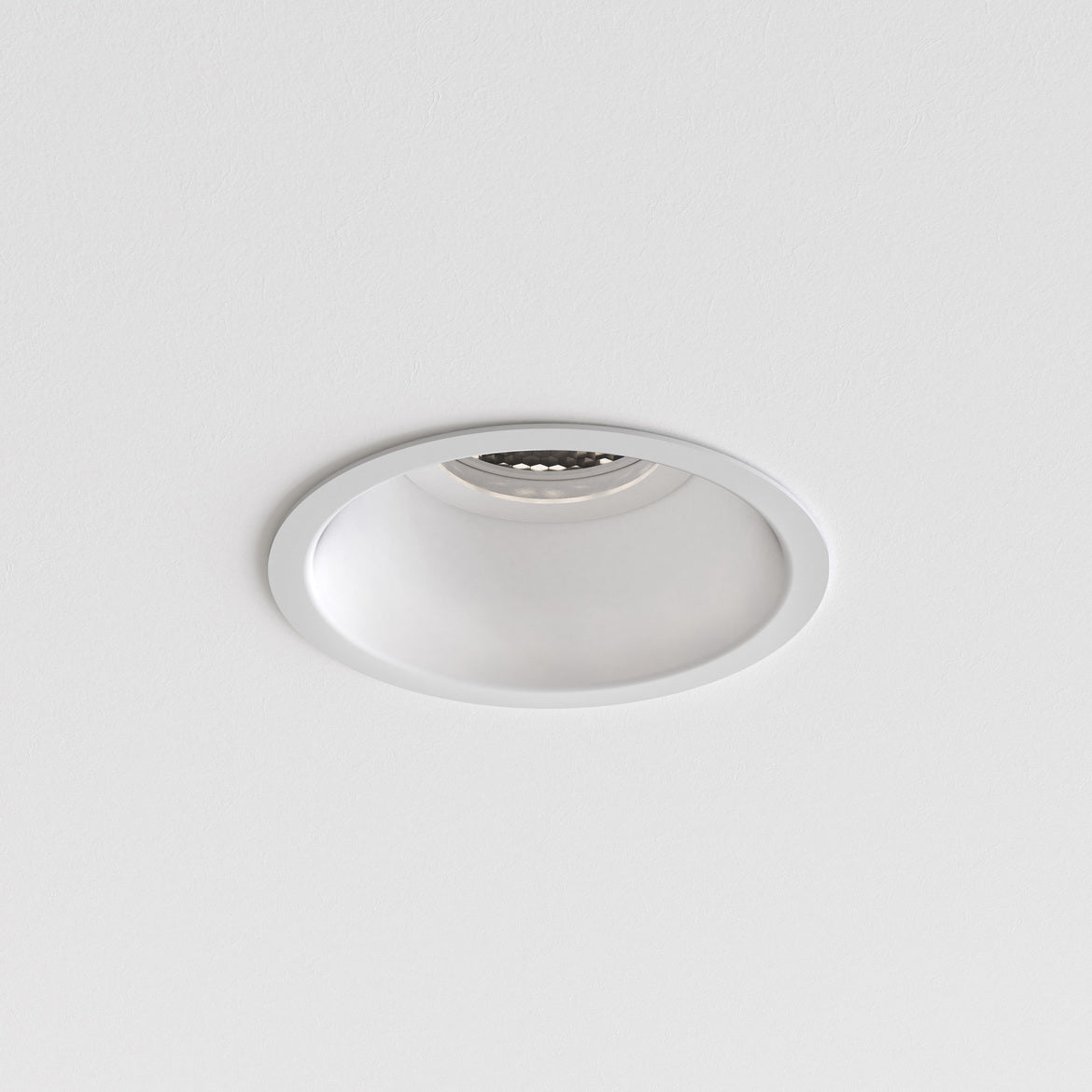 White recessed ceiling light on a gray background