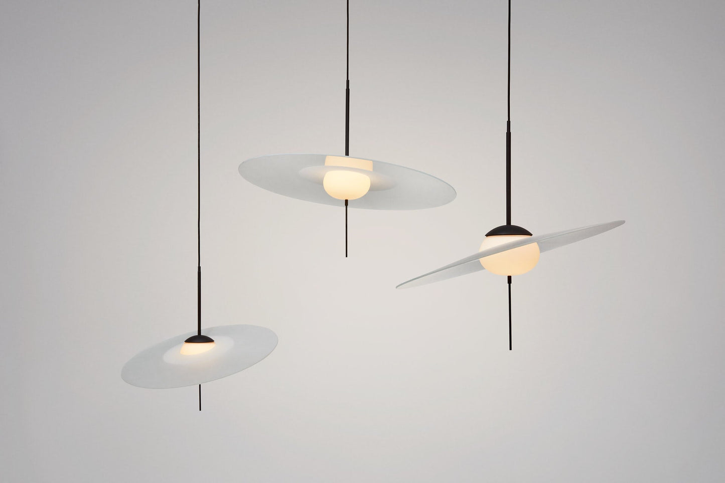 DCW Editions Mono 40, 50 and 60 pendants on grey background