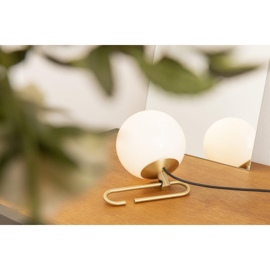 Nihm-Table-Lamp-In-Situ-on-Wooden-Table-with-Mirror-and-Plant