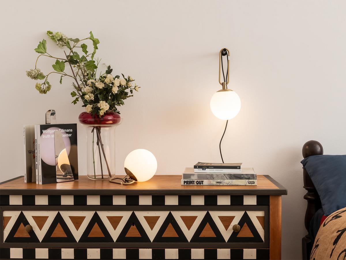 Nihm-Wall-and-Table-Lit-with-Patterned-Dresser-In-Bedroom