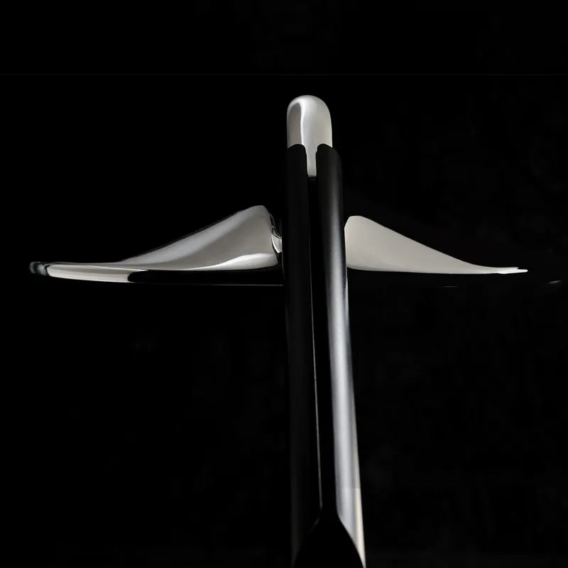 DCW Editions Niwaki black and chrome desk light from the back with black background