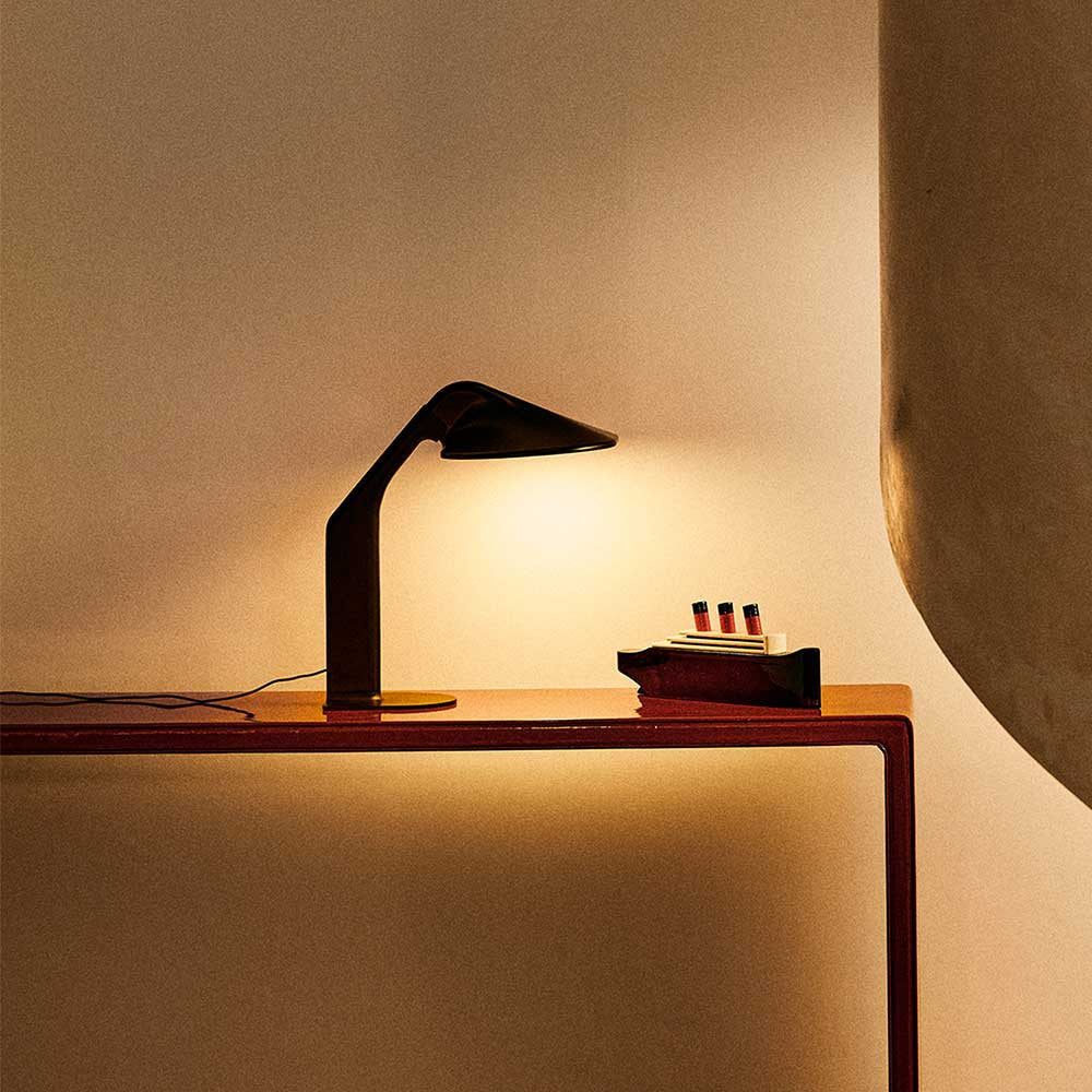 DCW Editions Niwaki desk light illuminating wooden boat model on console table