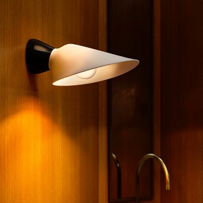 DCW Editions Plume Wall Light on wooden wall with sink tap