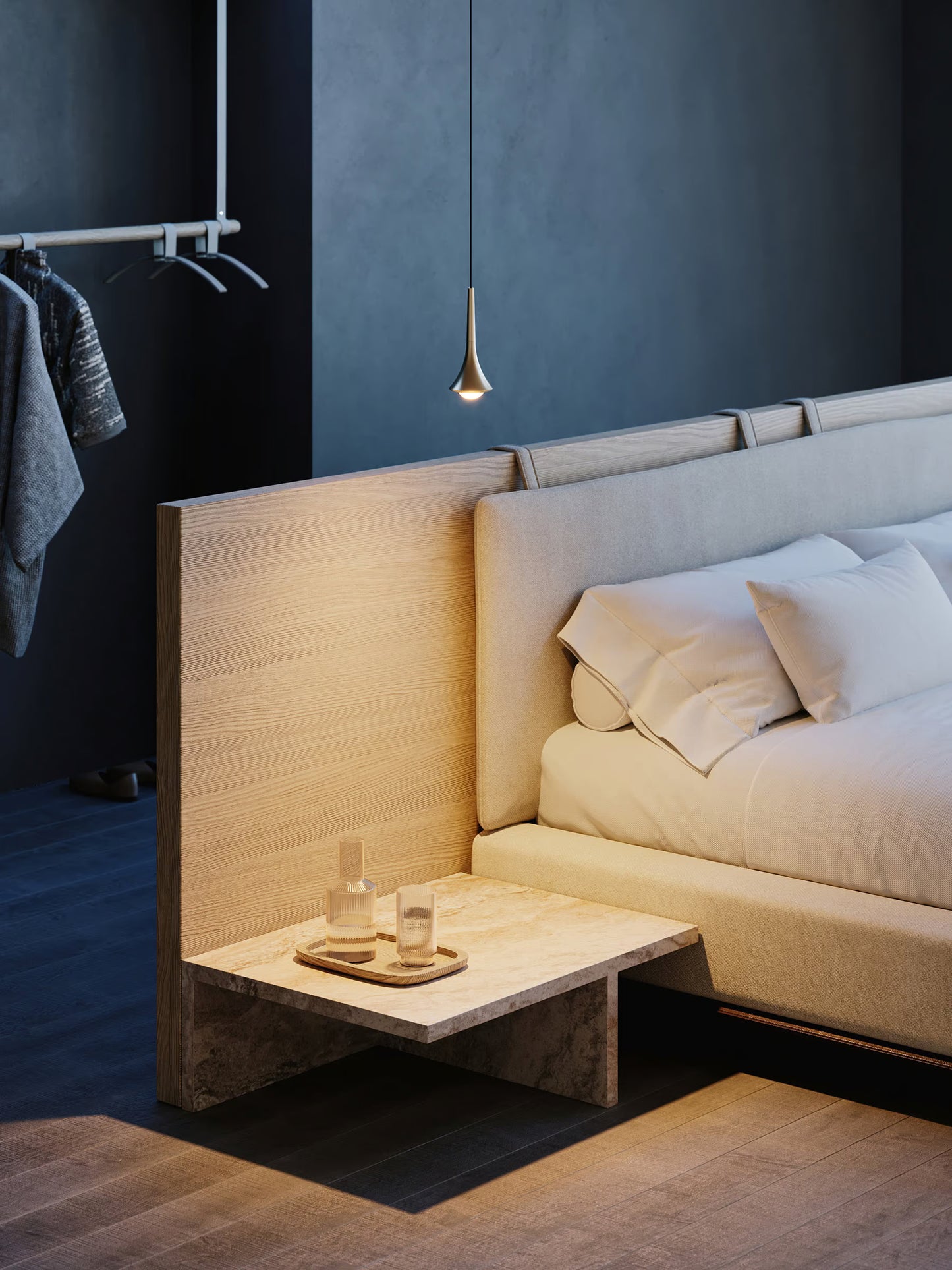 Lodes Rain pendant in champagne hung by a bed with with a low wooden bedside table