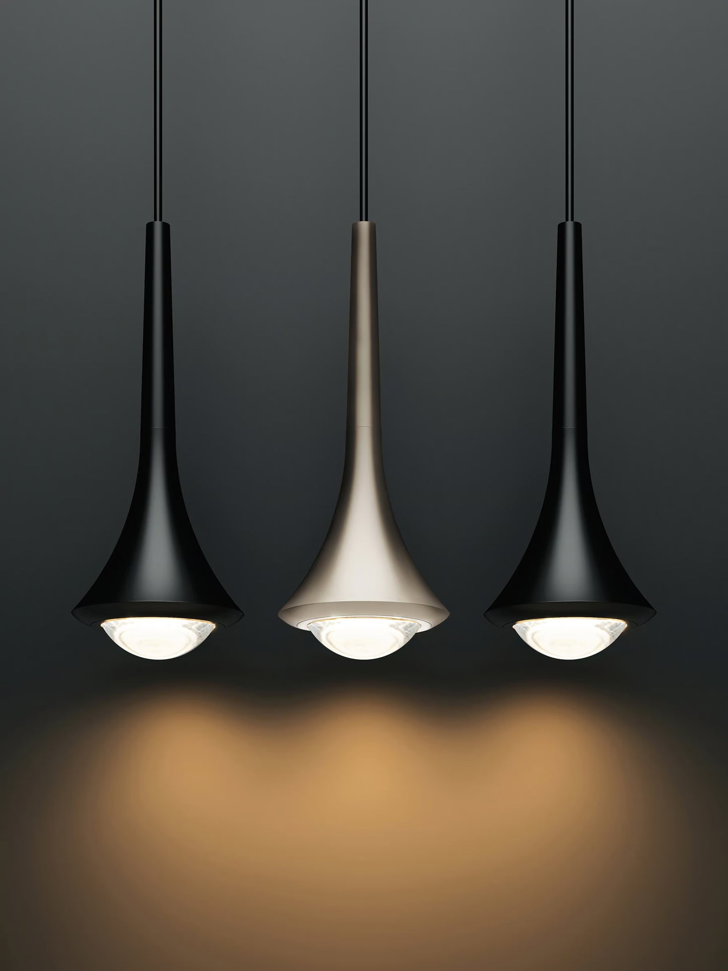 Rain pendant by Lodes in black with champagne finish in the middle on a black background