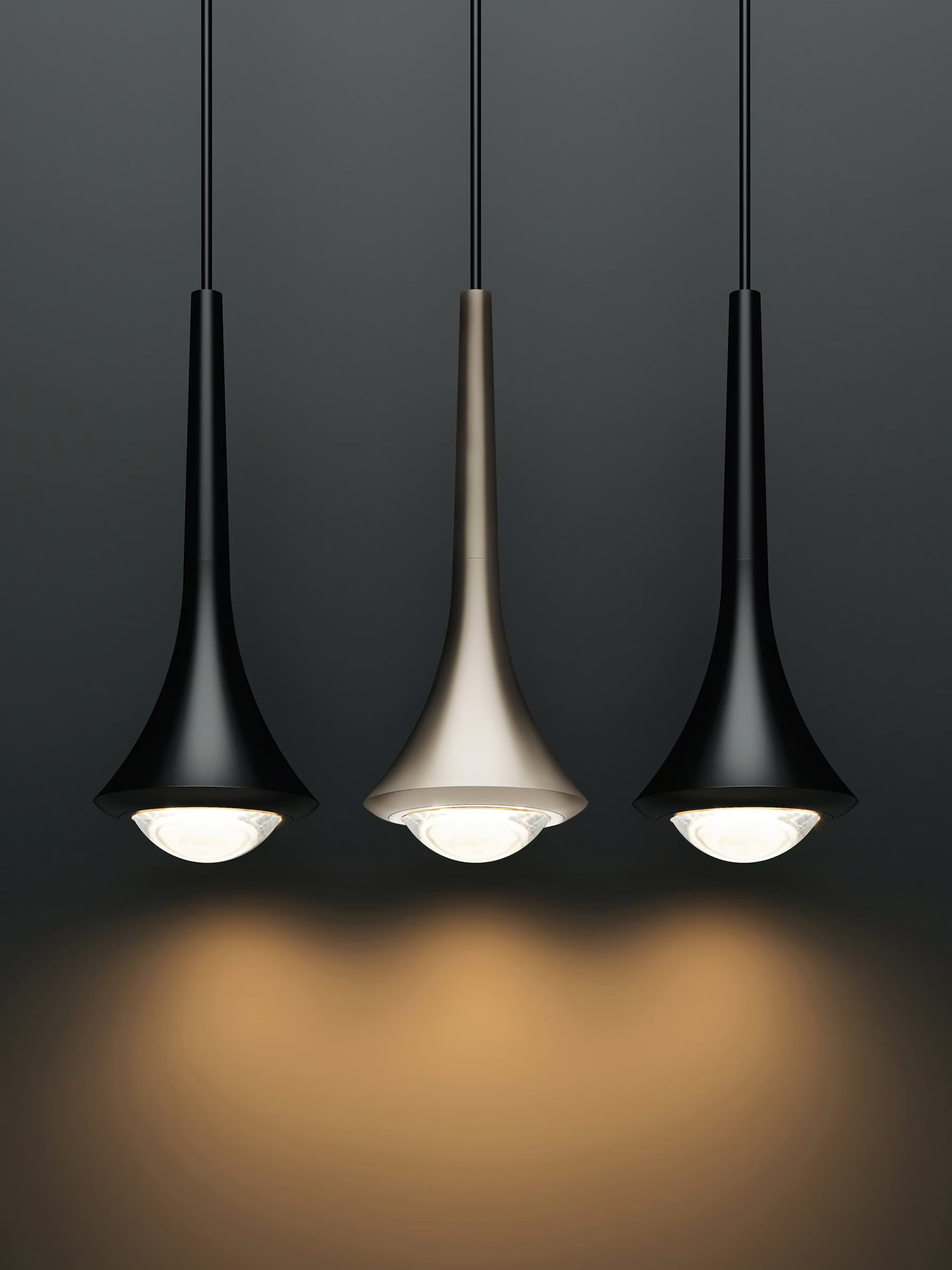 Rain pendant by Lodes in black with champagne finish in the middle on a black background