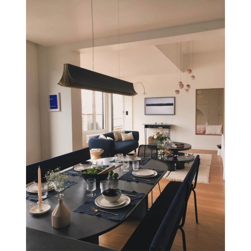 DCW Editions Respiro black and gold 1200mm linear pendant over dining table, unlit
