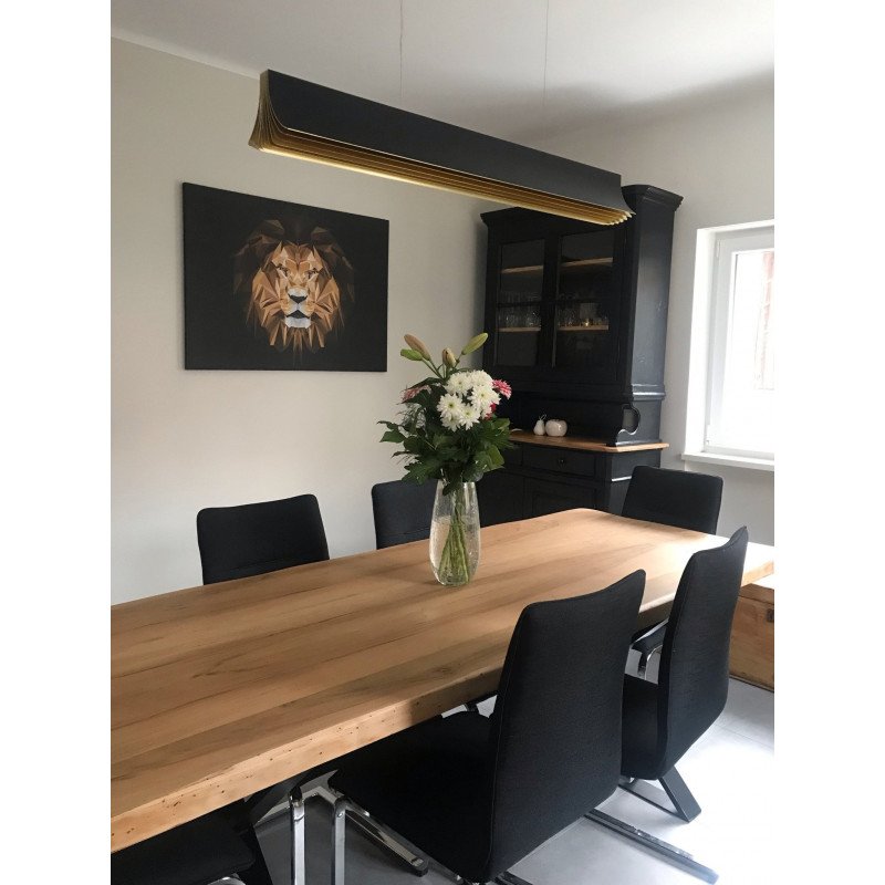 DCW Editions Respiro black and gold 1200mm linear pendant over wooden table with chairs and lion painting