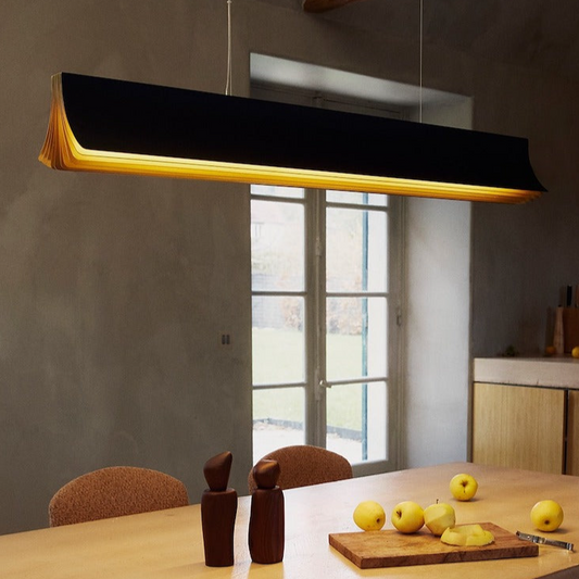DCW Editions Respiro black and gold 1200mm linear pendant over kitchen table with apples
