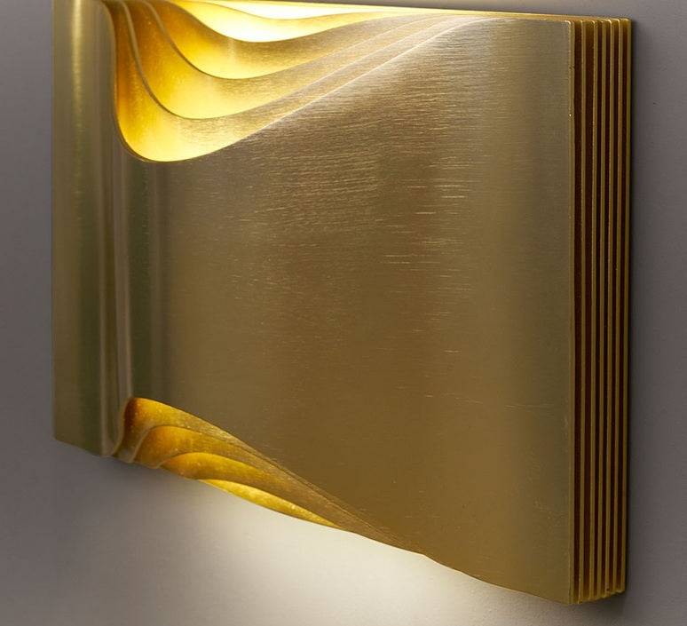 DCW Editions Respiro brass wall light with curved brass metal