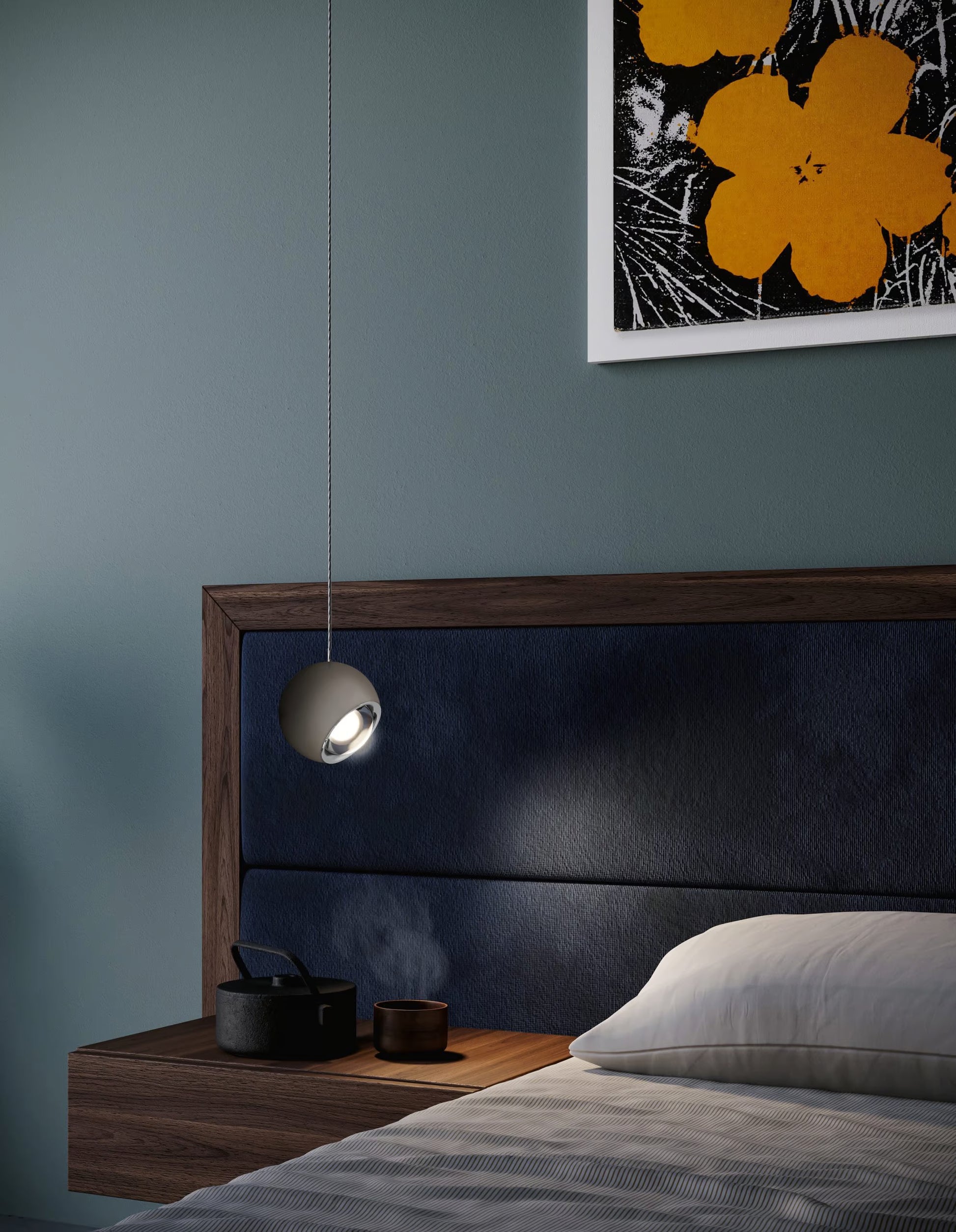 Lodes Spider pendant in white finish next to a bed with a blue headboard