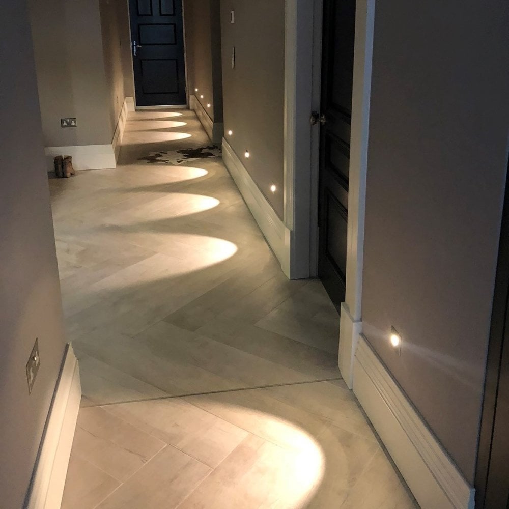 Astro Tango step light in brushed steel down long narrow hallway