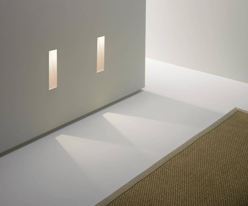 Astro Borgo step light trimless vertical 35 on grey wall shining onto floor with rug